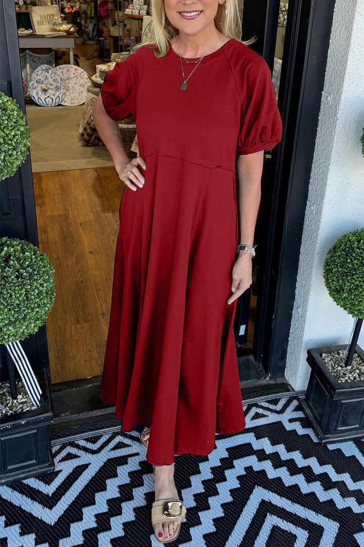 A chic long dress with a round neckline and puff sleeves