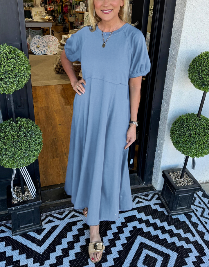 A chic long dress with a round neckline and puff sleeves