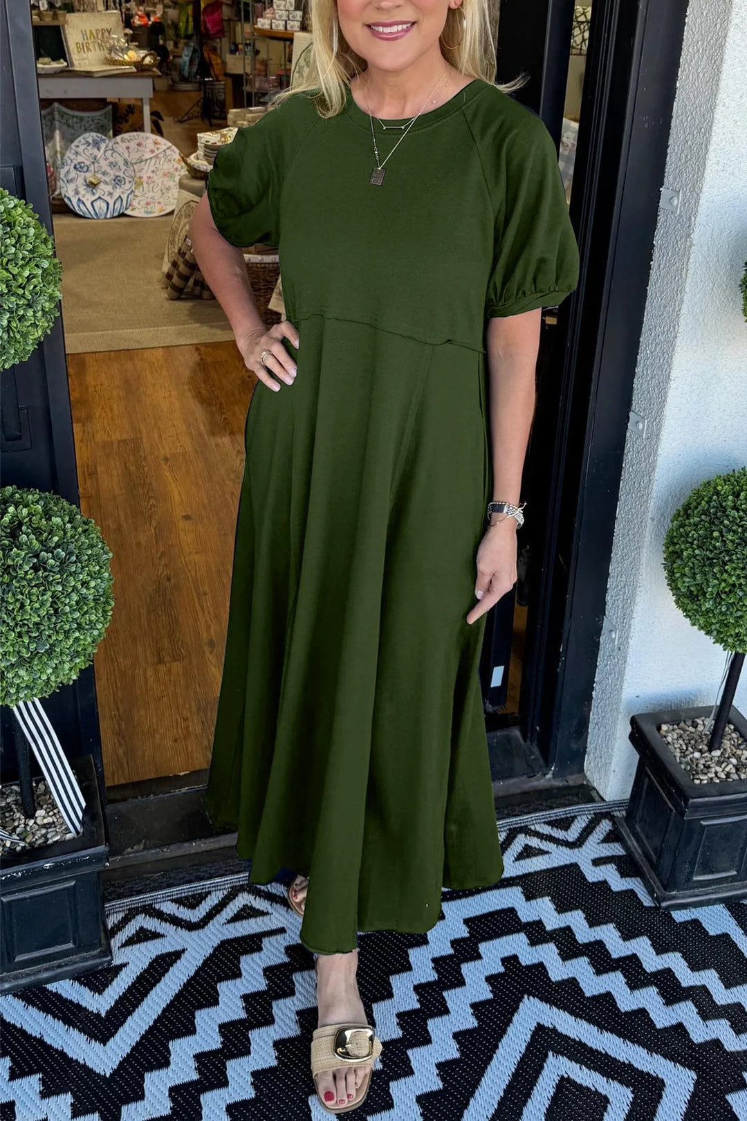A chic long dress with a round neckline and puff sleeves