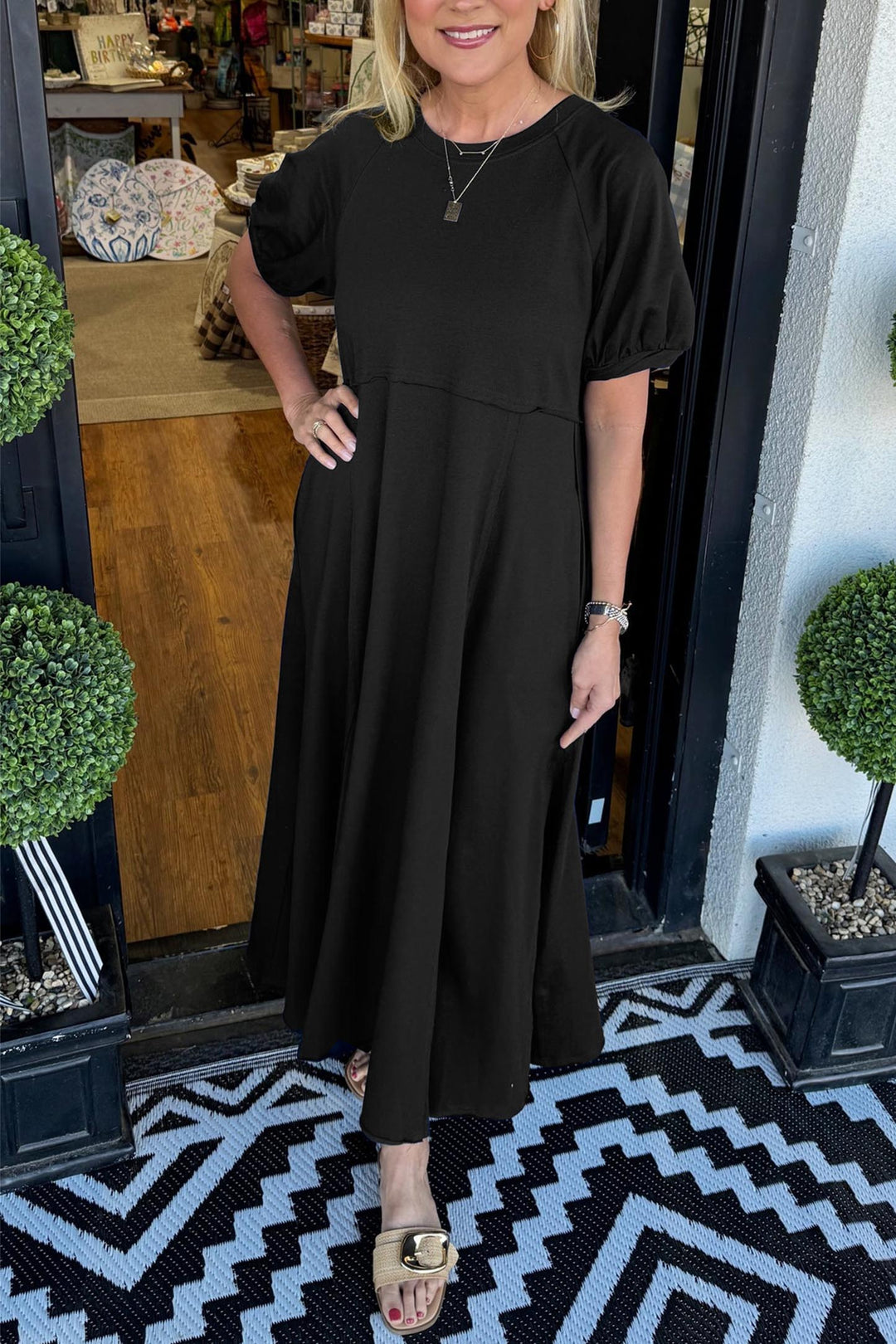 A chic long dress with a round neckline and puff sleeves