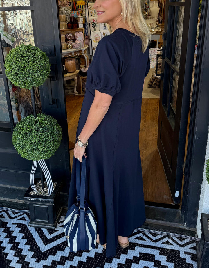 A chic long dress with a round neckline and puff sleeves